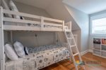 The upstairs kid`s room has a set of twin bunks.